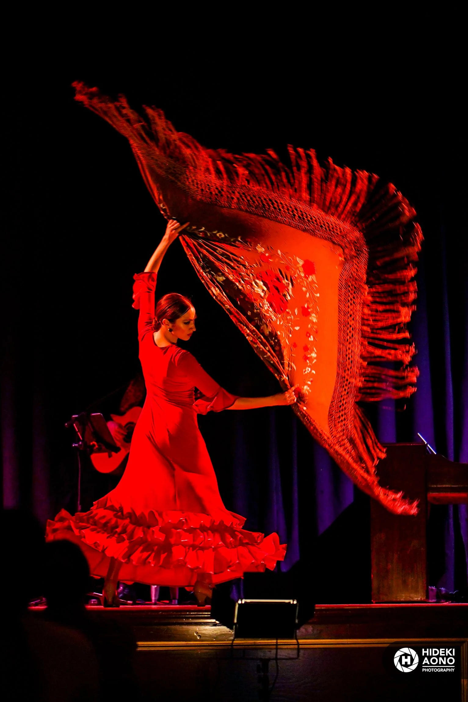 Performance photography portrait in warm stage light